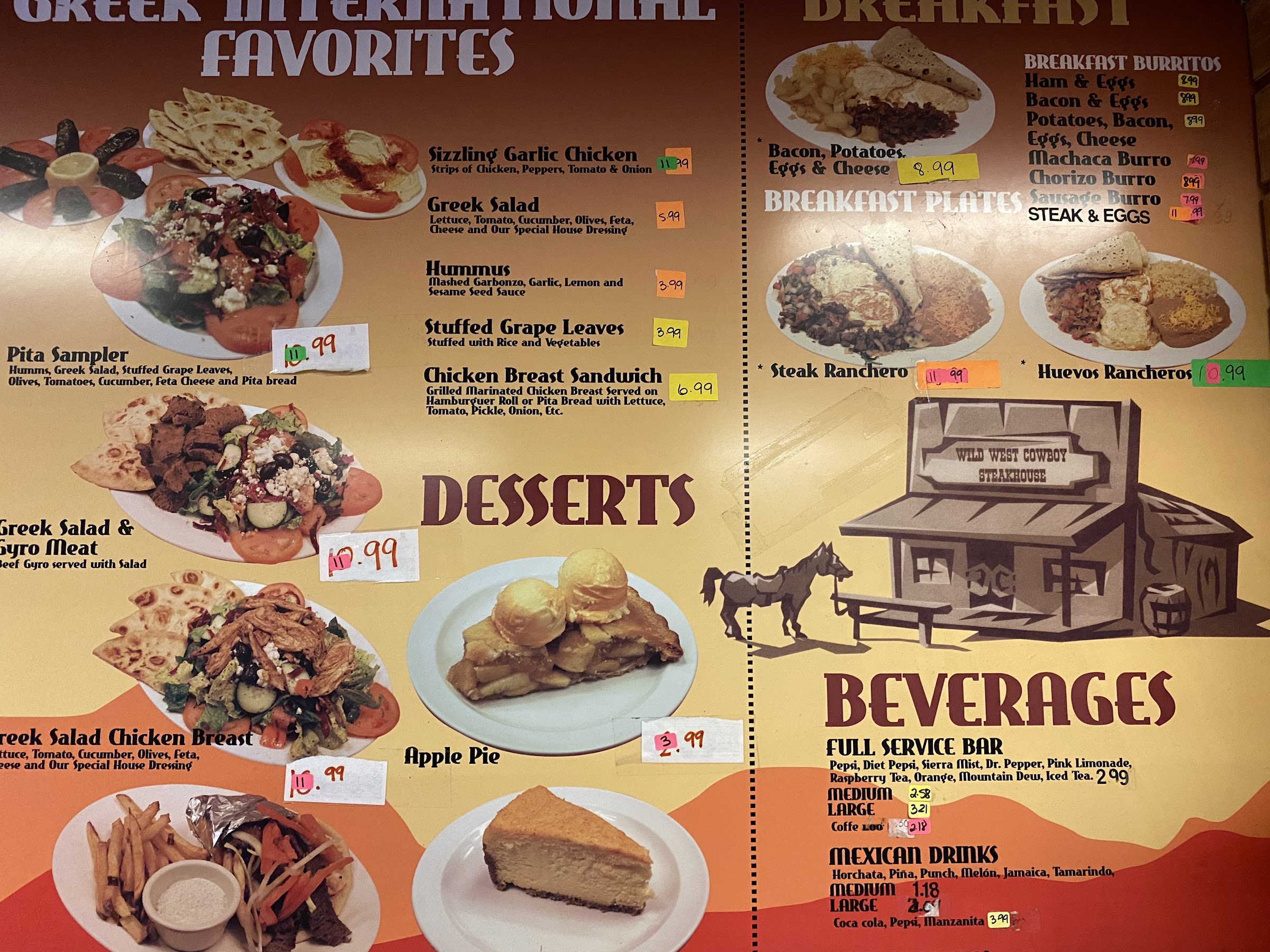 Hand-painted menu board showing breakfast and Greek favorites.