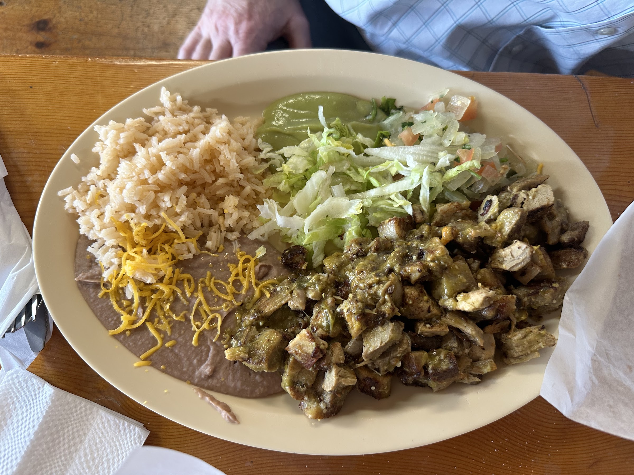 Green-chile chicken plate with rice, beans, and salad at Wild West Cowboy Steakhouse.